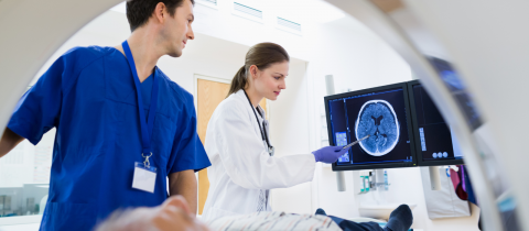 Doctors examine a patient.